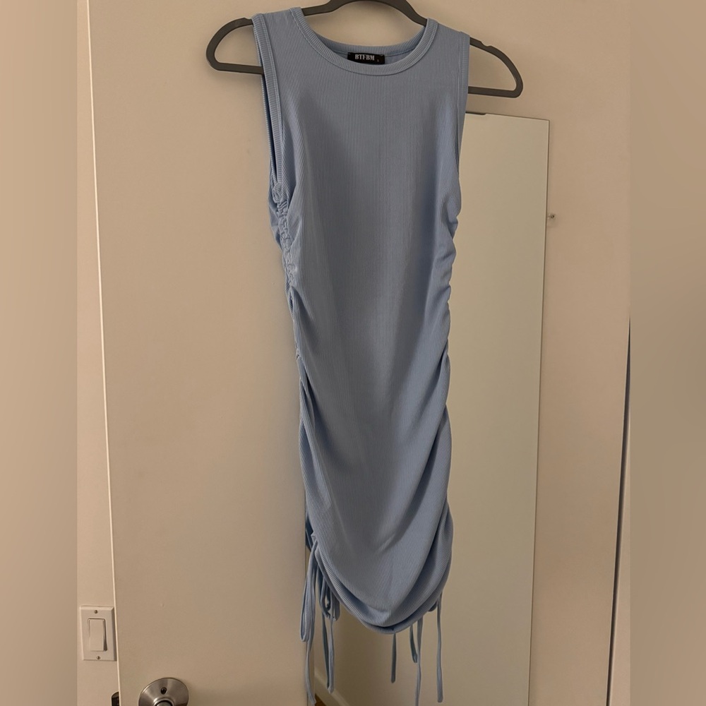 Women’s dress (ties to go longer or shorter); size small